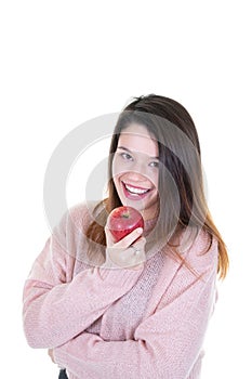 A young woman on white background with red apple smiling and laughing