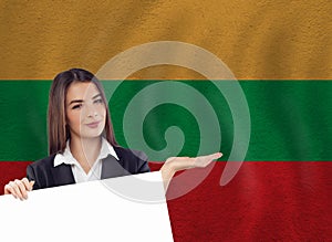 Young woman with white banner and national flag