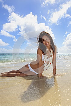 Young woman in a white bikini