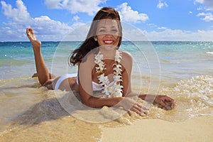 Young woman in a white bikini