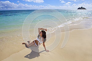 Young woman in a white bikini