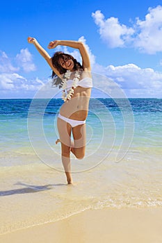 Young woman in a white bikini