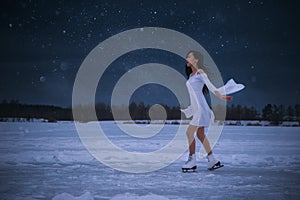 Young woman in white dress ice skating