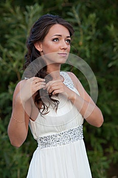 Young woman in white dress on nature