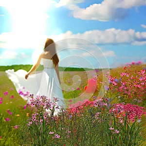 Young woman in white dress sun flares  summer nature landscape  wild field grass and colorful flowers on horizon,art Monet style