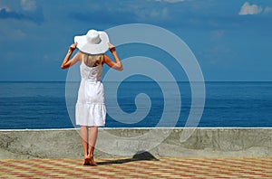 Young woman in a white hat