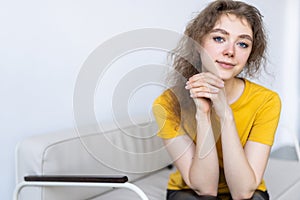 Young woman with white perfect smile looking at camera at home