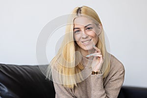 Young woman with white perfect smile looking at camera at home