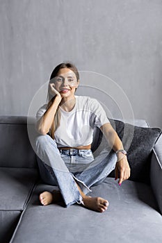 Young woman with white perfect smile looking at camera at home