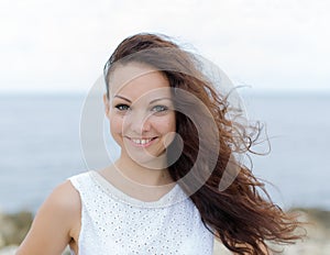 Portrait of girl with curly hair and gap between teeth