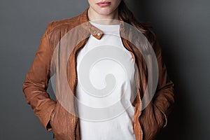 Young woman  in white  t-shirt  and brown leather jacket studio shot, t shirt mock up