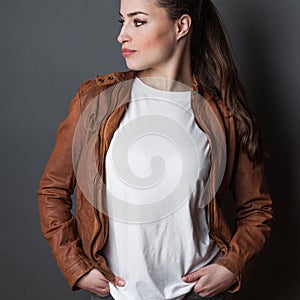 Young woman in white t-shirt and brown leather jacket studio shot, t shirt mock up