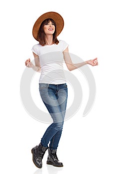 Young Happy Woman Is Snaping With Fingers And Looking Away