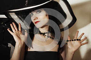 Young woman in a wide-brimmed hat photo