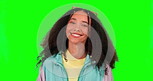 Young woman, wink and face with green screen and studio feeling happy and funny. Gen z, fashion and emoji, fun and