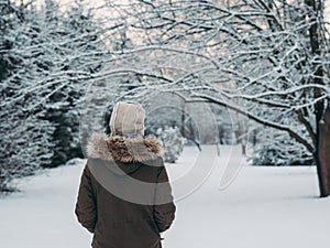 Young woman in winter forest