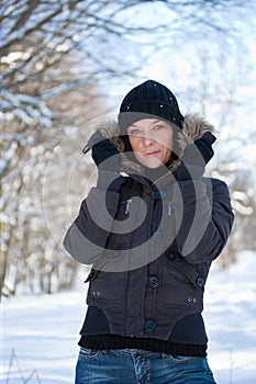 Young woman in winter forest