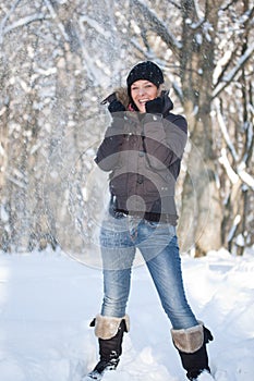 Young woman in winter forest