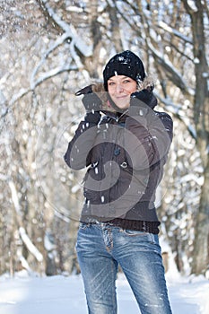 Young woman in winter forest