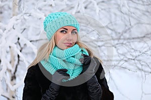 Young woman in a winter forest