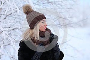 Young woman in a winter forest