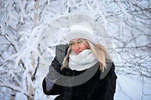 Young woman in a winter forest