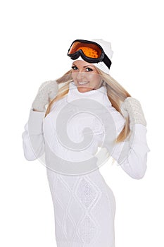 Young woman in winter warm clothes and ski glasses