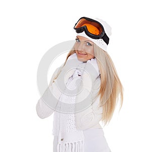 Young woman in winter warm clothes and ski glasses