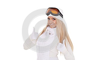 Young woman in winter warm clothes and ski glasses