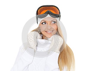 Young woman in winter warm clothes and ski glasses.