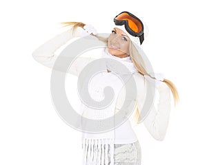 Young woman in winter warm clothes and ski glasses.