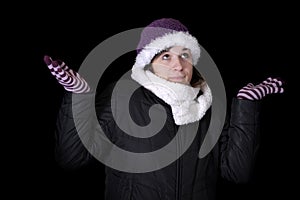 young woman in winterclothes looking up
