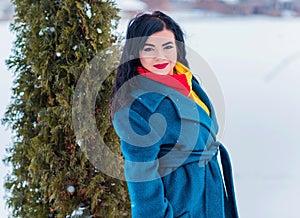 Young woman in wool  coat at winter day