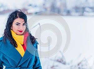 Young woman in wool  coat at winter day