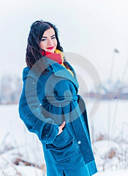 Young woman in wool  coat at winter day