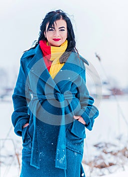 Young woman in wool  coat at winter day