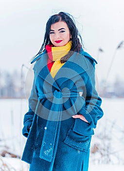 Young woman in wool  coat at winter day