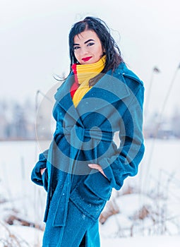 Young woman in wool  coat at winter day