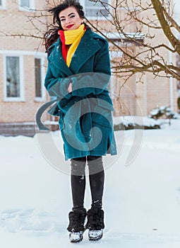 Young woman in wool  coat at winter day