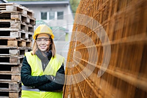 Young woman worker in an industrial area.