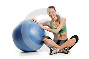 Young Woman workin gout with Swiss Ball