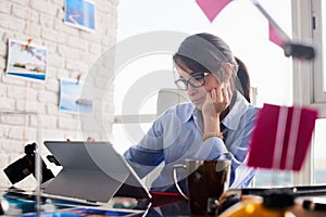 Young Woman Working As Professional Photographer In Studio