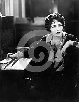 Young woman working as a telephone operator