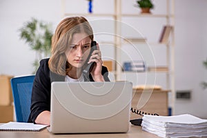 Young woman working in box delivery service