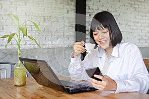 Young woman working it cafe