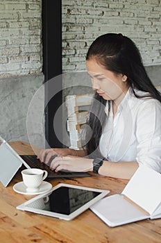 Young woman working it cafe