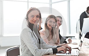 Young woman working in a call center team.