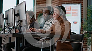 Young woman working at customer assistance service