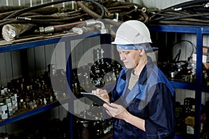 Young Woman Working In Factory Warehouse