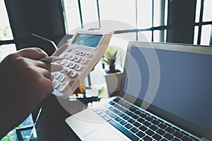 The young woman is working on a financial account to prepare to be promoted to the head of the account